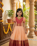 Girls Peach Pattu Pavadai Gown in Peach Pink - Silk Blend Gown for kids - front view