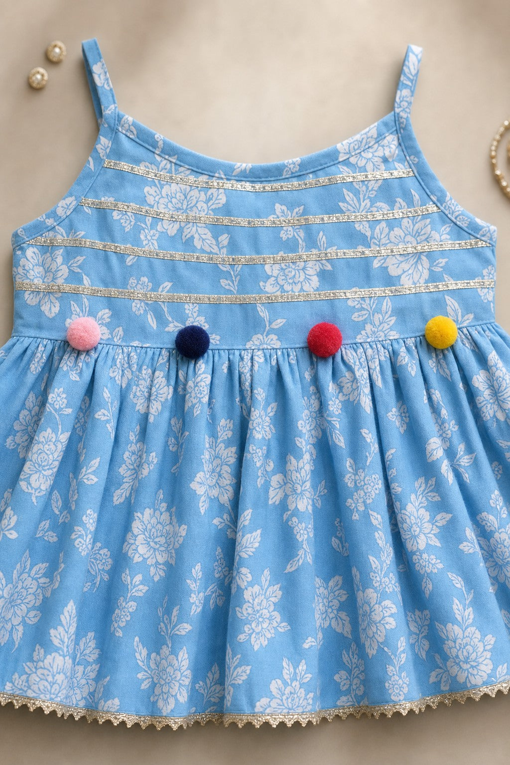 Girls Floral Print Kurti Sharara Set Blue - close-up detail of kurti and pom-poms