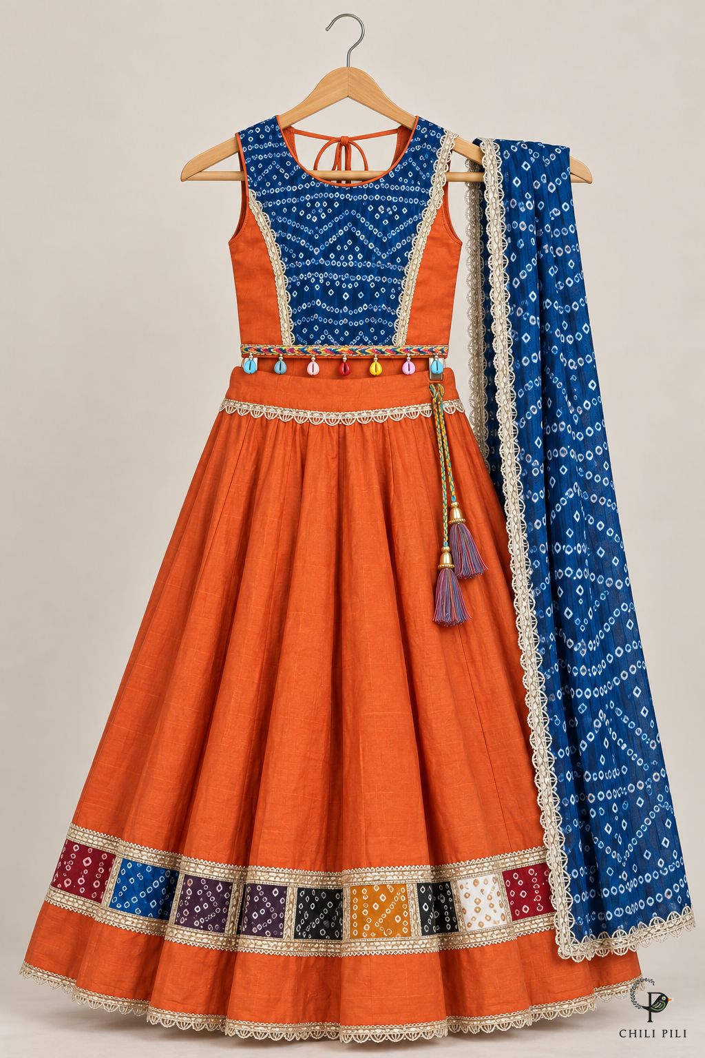 Girls Bandhani Patchwork Lehenga Choli Orange - full set on hanger